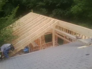 Framing a new roof addition that ties into an existing shingle roof in Vandalia
